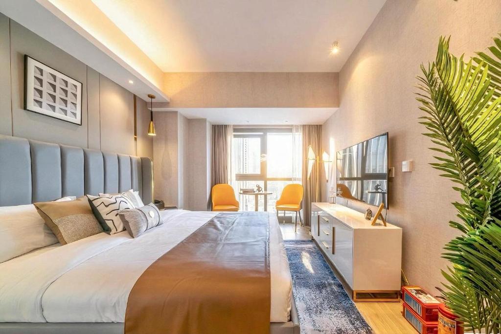 Postel nebo postele na pokoji v ubytování Yomanjoo City View Hotel - Shenzhen Nanshan Coastal City Flagship Store