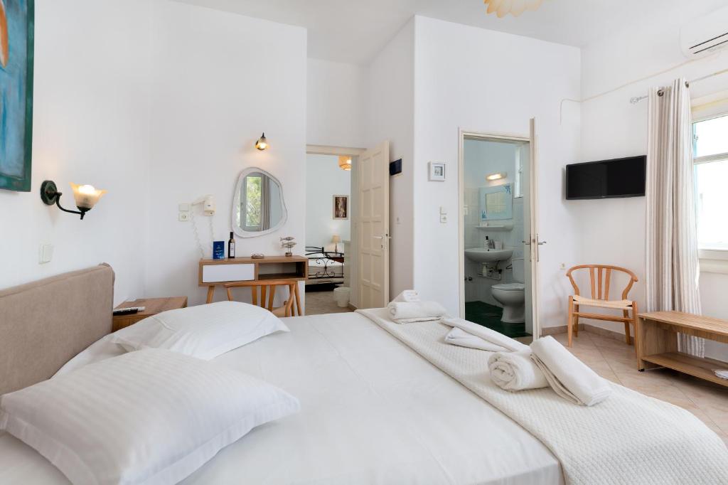 Postel nebo postele na pokoji v ubytování Akteon Hotel