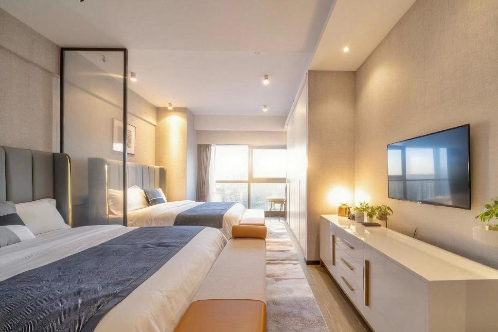 Postel nebo postele na pokoji v ubytování Yomanjoo City View Hotel - Shenzhen Nanshan Coastal City Flagship Store