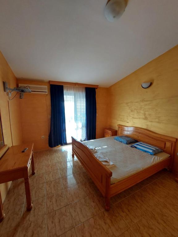 Postel nebo postele na pokoji v ubytování Vidikovac