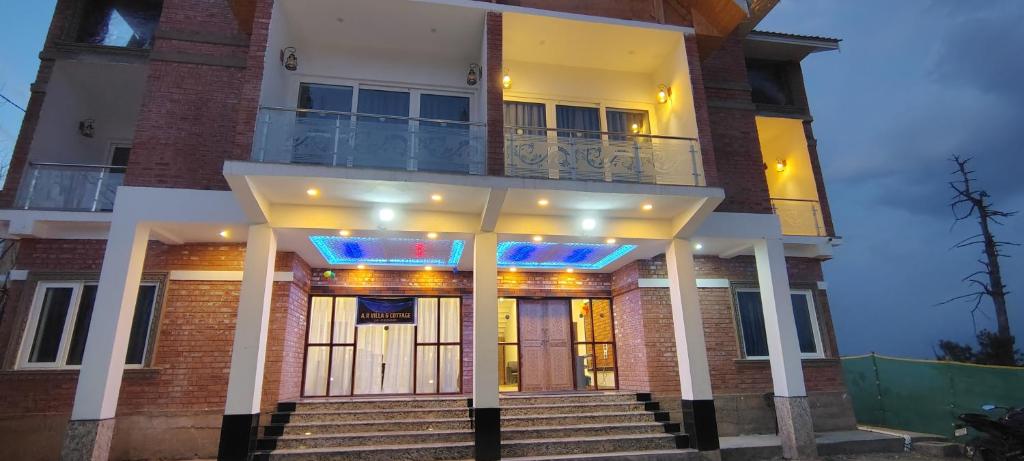 a house with a staircase in front of it at A R villa and cottage in Gulmarg
