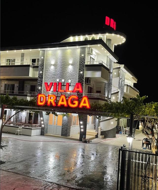 a building with a sign that reads villa dragosa at Draga in Ulcinj