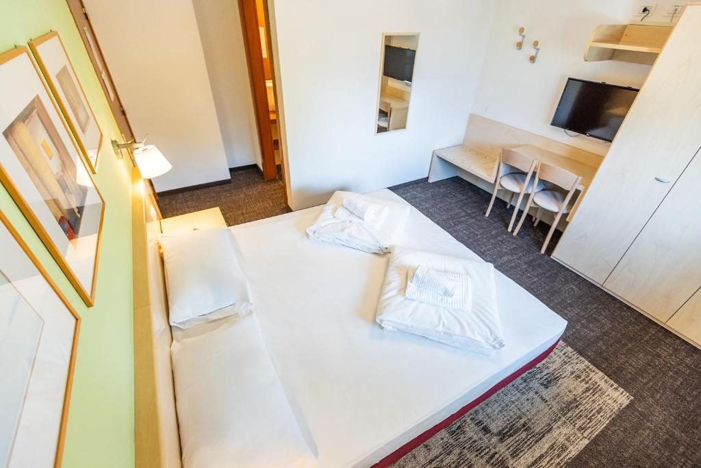 Postel nebo postele na pokoji v ubytování Hotel Heide Park
