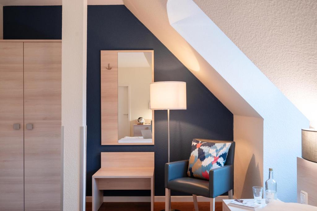 Postel nebo postele na pokoji v ubytování Hotel Alte Fischereischule