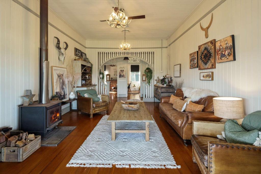 a living room with a couch and a table at Beam Creek Cottage - Montville in Montville