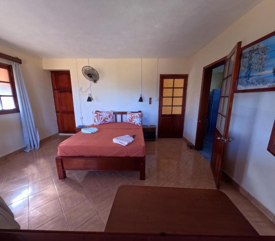 Postel nebo postele na pokoji v ubytování Le Tropical Chez Jeannette