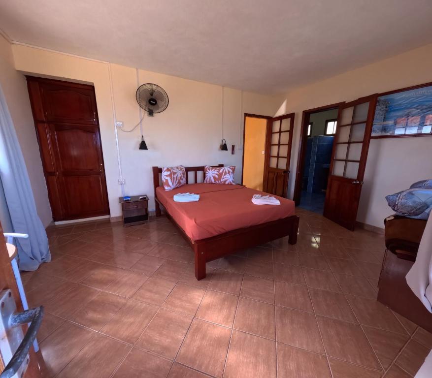 Postel nebo postele na pokoji v ubytování Le Tropical Chez Jeannette