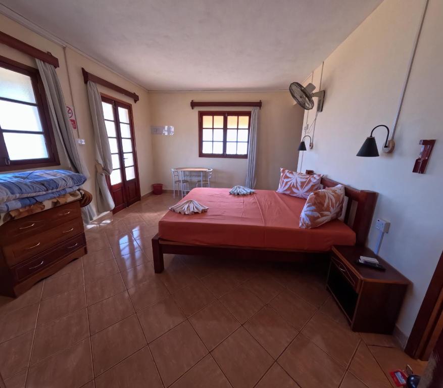 Postel nebo postele na pokoji v ubytování Le Tropical Chez Jeannette