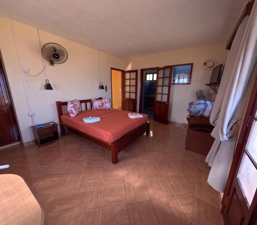 Postel nebo postele na pokoji v ubytování Le Tropical Chez Jeannette