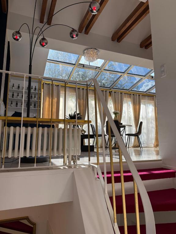 a staircase in a house with a glass ceiling at Starlight in Hamburg