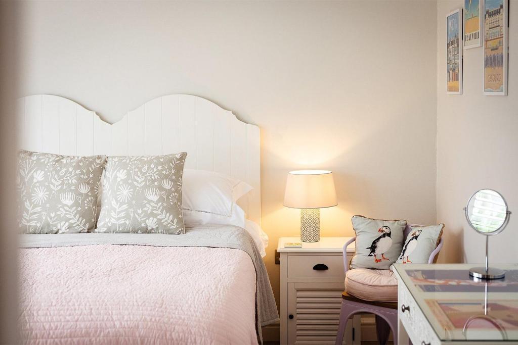 Voodi või voodid majutusasutuse Compass Rose toas