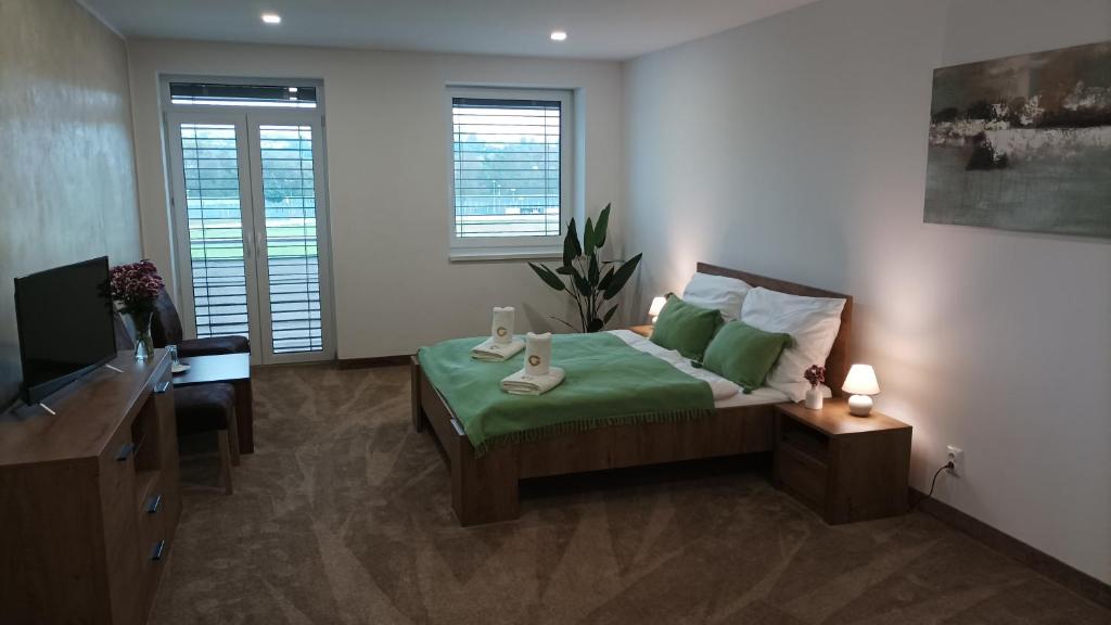 Postel nebo postele na pokoji v ubytování GÓL CENTRUM RESORT
