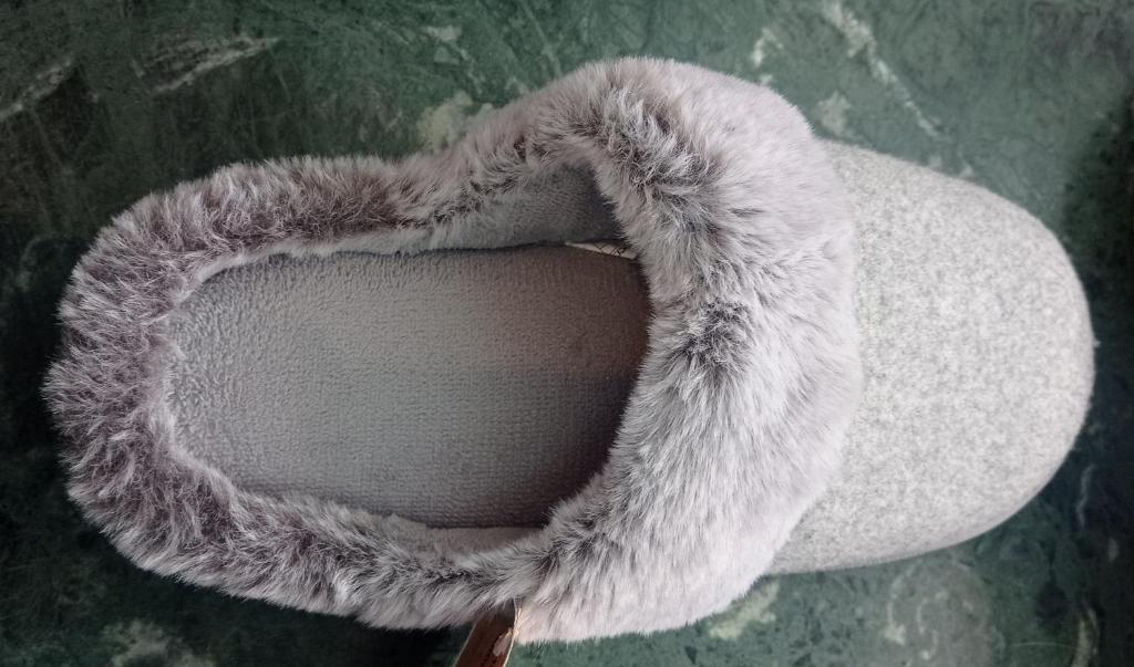 a white hat with a faux fur tail at Rebelsardine in Almada