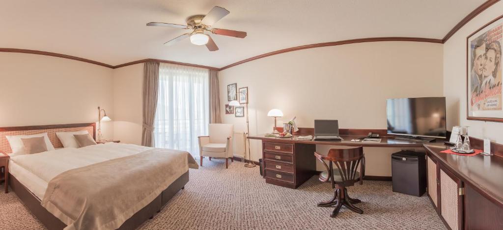 Postel nebo postele na pokoji v ubytování MAXX Hotel Jena