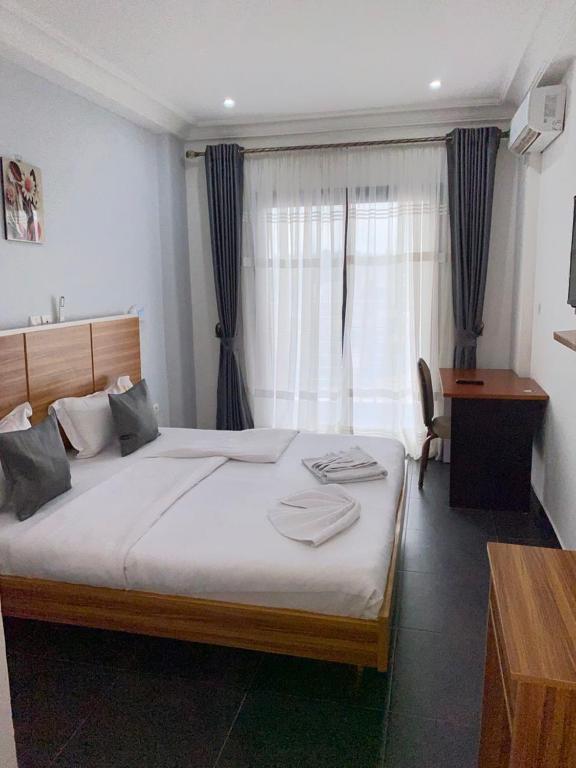 Postel nebo postele na pokoji v ubytování COFE Hotel Groupe