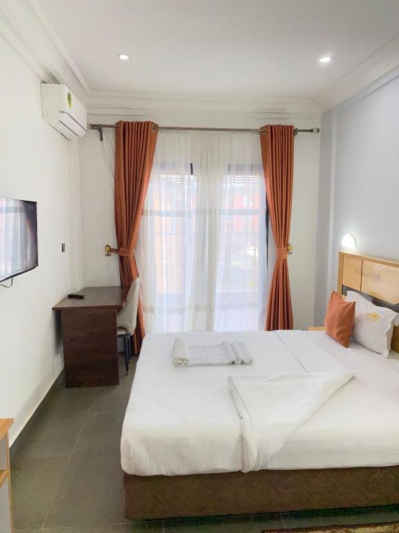 Postel nebo postele na pokoji v ubytování COFE Hotel Groupe