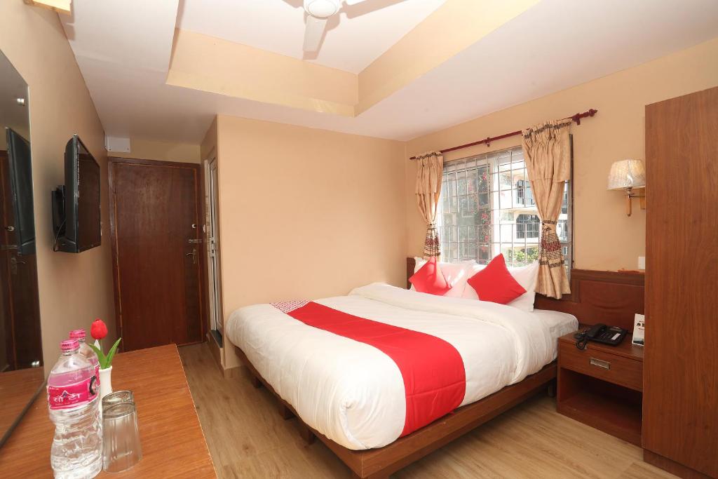 Postel nebo postele na pokoji v ubytování Hotel Om