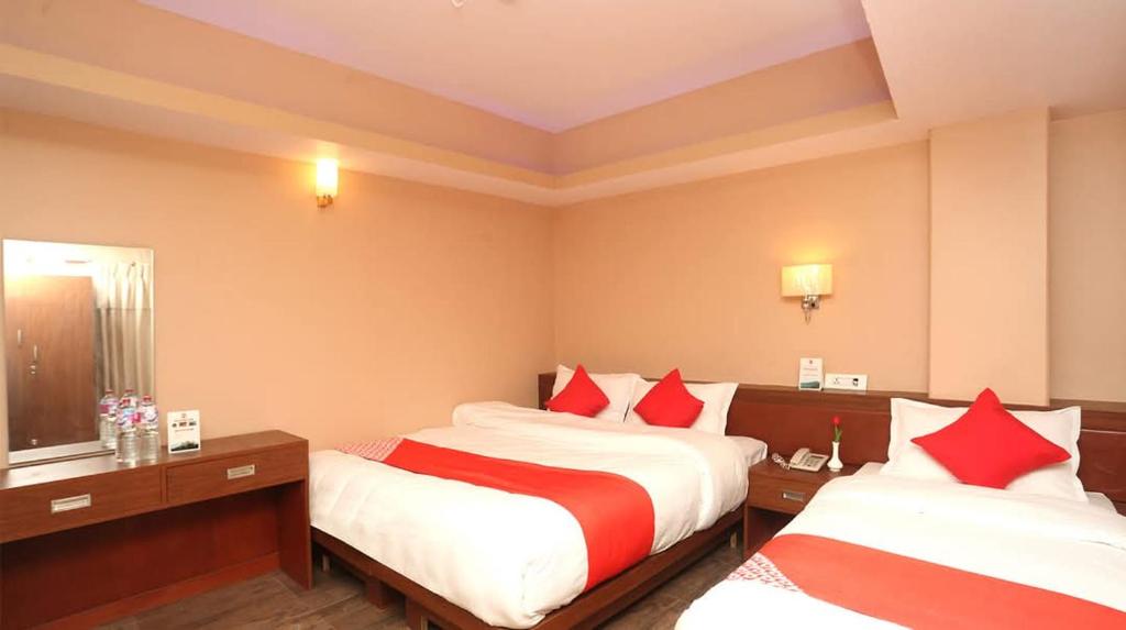 Postel nebo postele na pokoji v ubytování Hotel Om