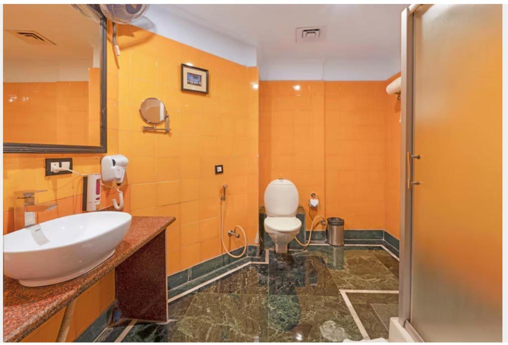 Koupelna v ubytování Indismart Hotel