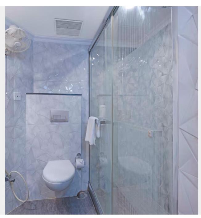 Koupelna v ubytování Indismart Hotel