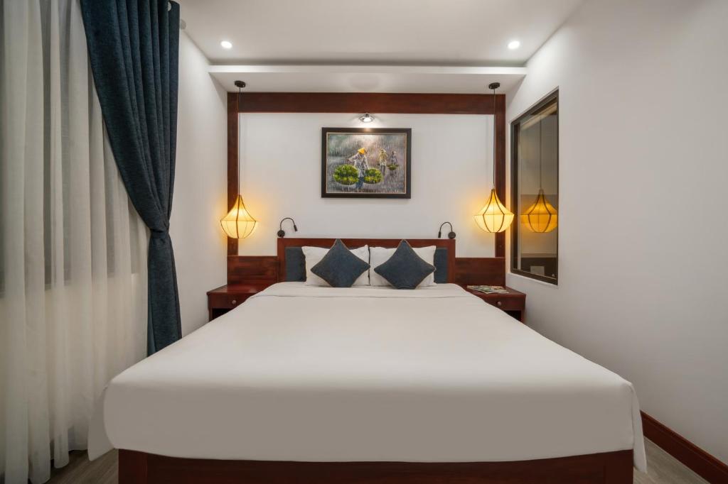 Postel nebo postele na pokoji v ubytování An Hotel