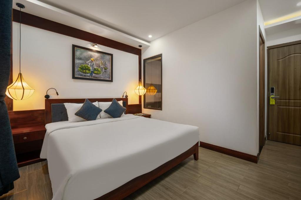 Postel nebo postele na pokoji v ubytování An Hotel