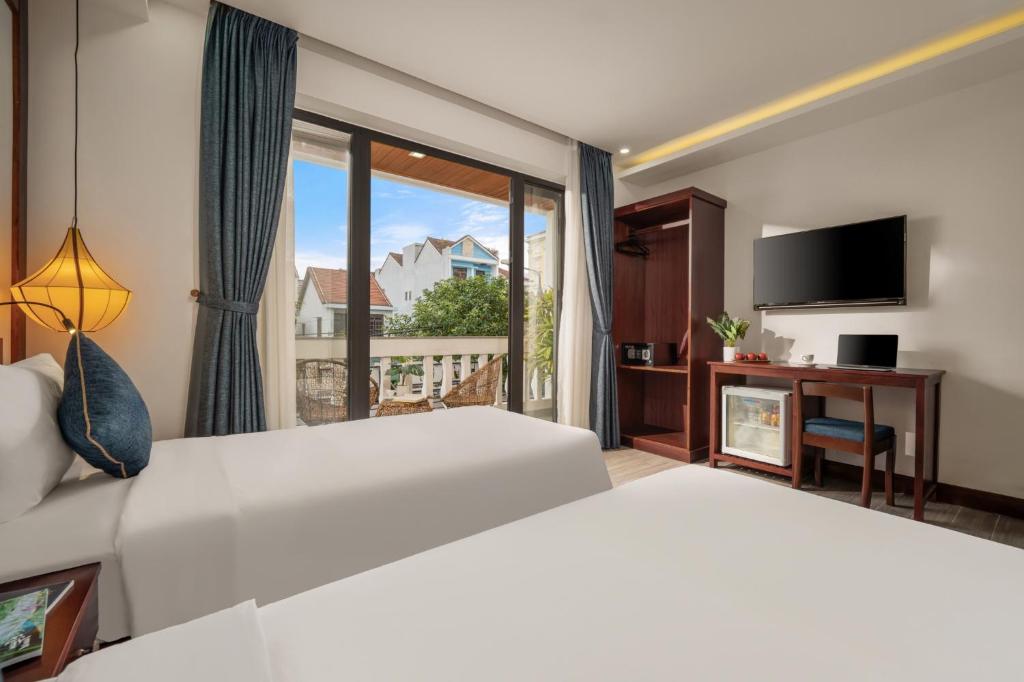 Postel nebo postele na pokoji v ubytování An Hotel