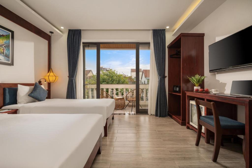 Postel nebo postele na pokoji v ubytování An Hotel