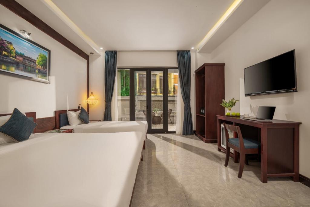 Postel nebo postele na pokoji v ubytování An Hotel
