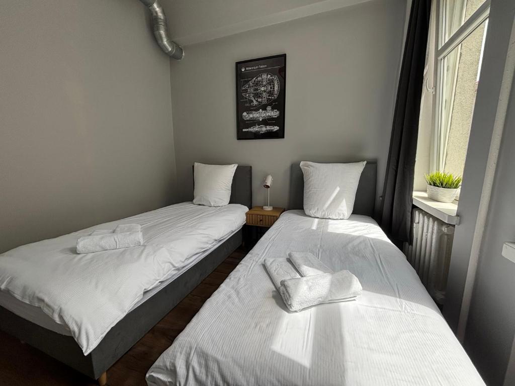 Postel nebo postele na pokoji v ubytování Hala Hostel - Pokoje na wyłączność tuż przy Dworcu Gdynia