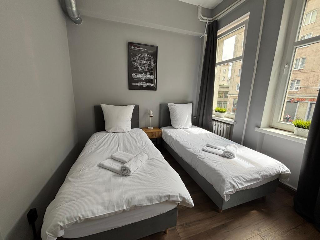 Postel nebo postele na pokoji v ubytování Hala Hostel - Pokoje na wyłączność tuż przy Dworcu Gdynia