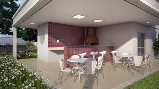a patio with a table and chairs on it at Só 1 Quarto Belle Nature in Valparaíso de Goiás