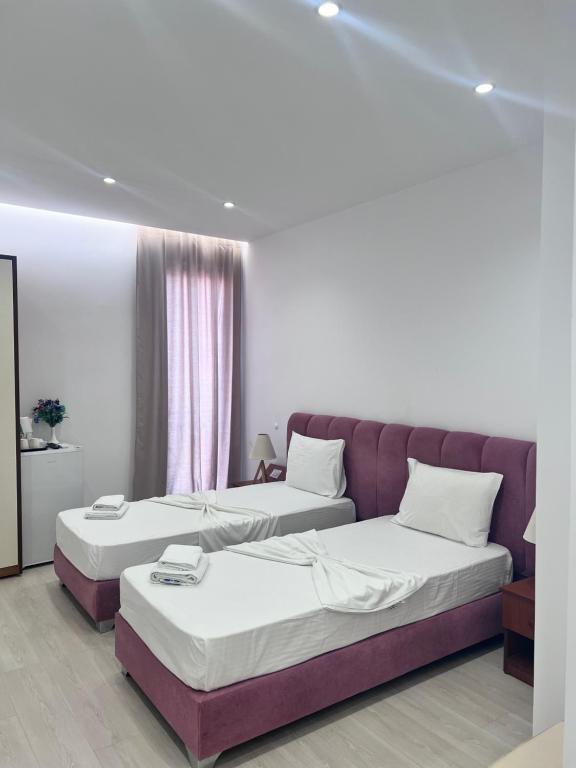 Postel nebo postele na pokoji v ubytování Hotel Veizi