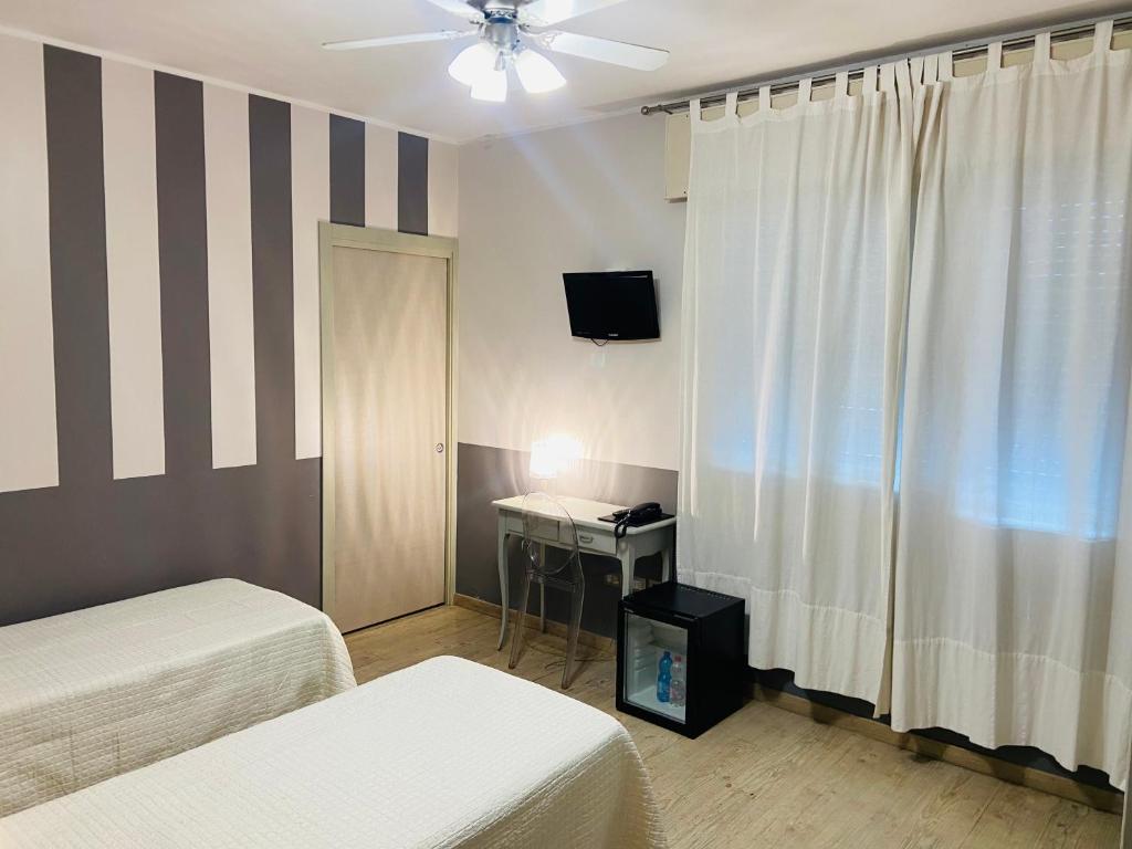 Postel nebo postele na pokoji v ubytování Hotel Volta