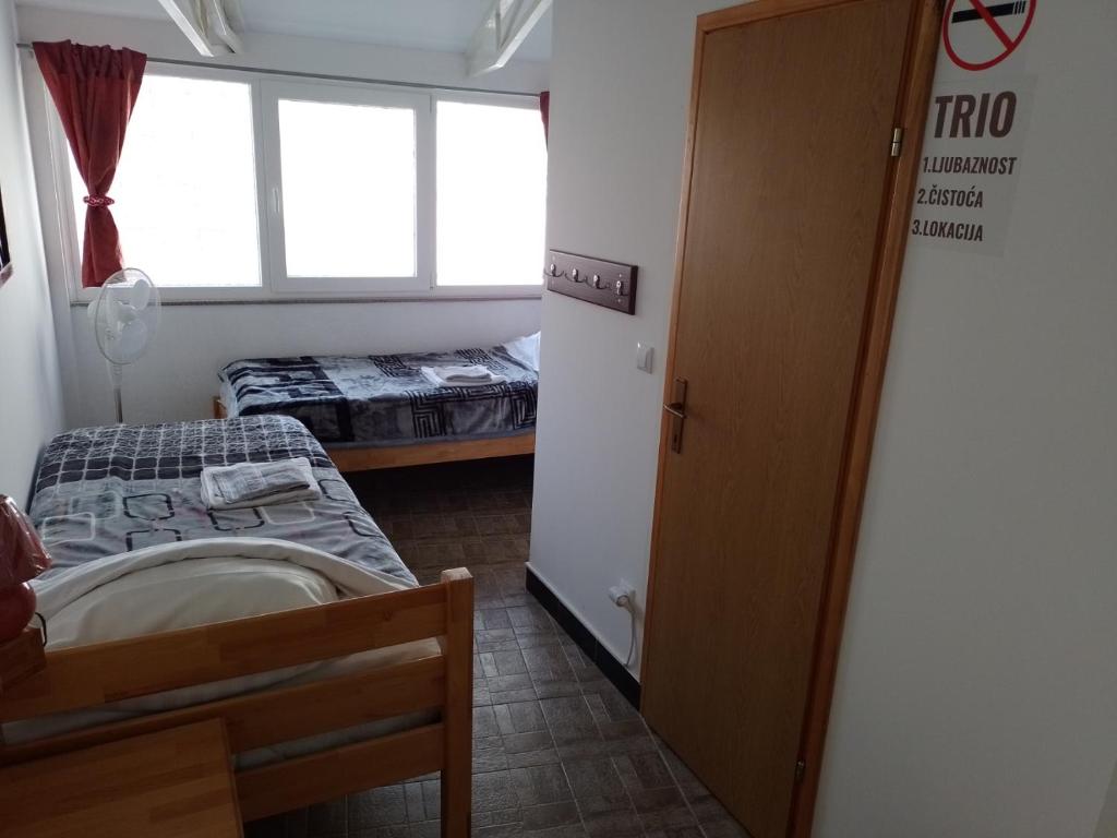 Postel nebo postele na pokoji v ubytování TRIO sobe