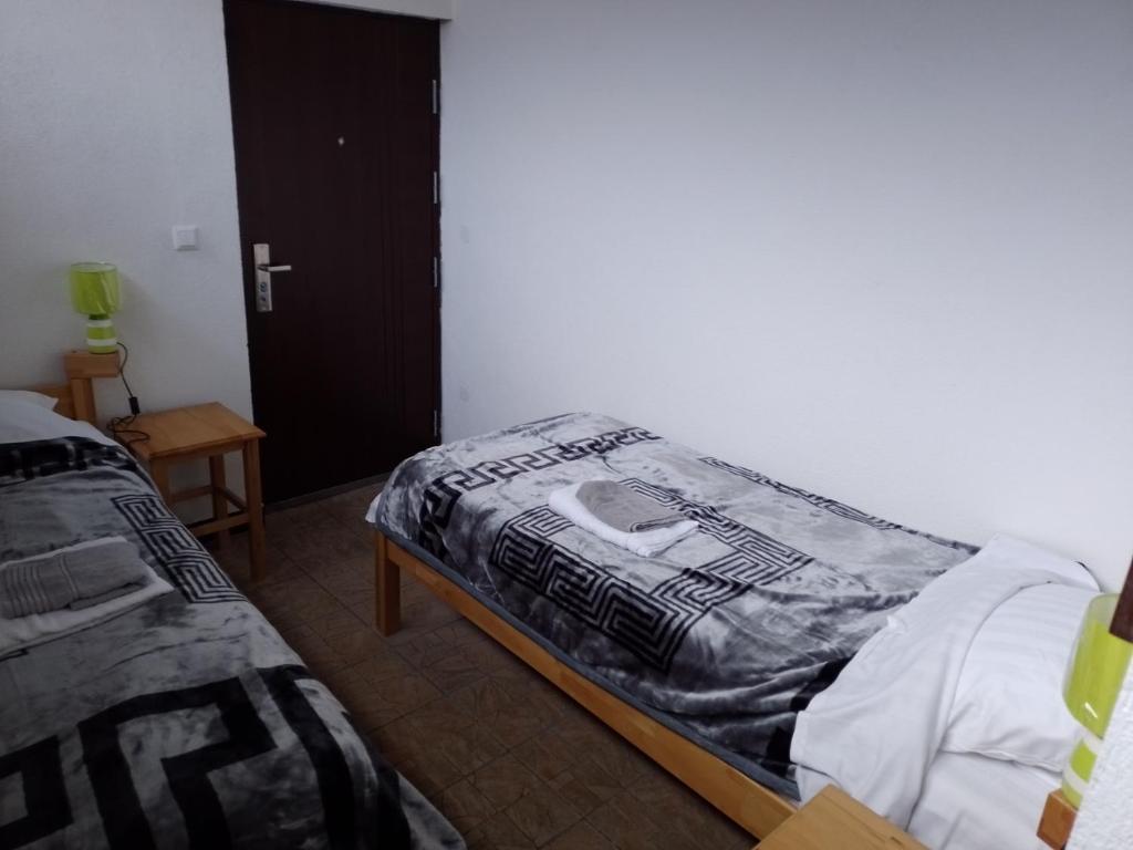 Postel nebo postele na pokoji v ubytování TRIO sobe