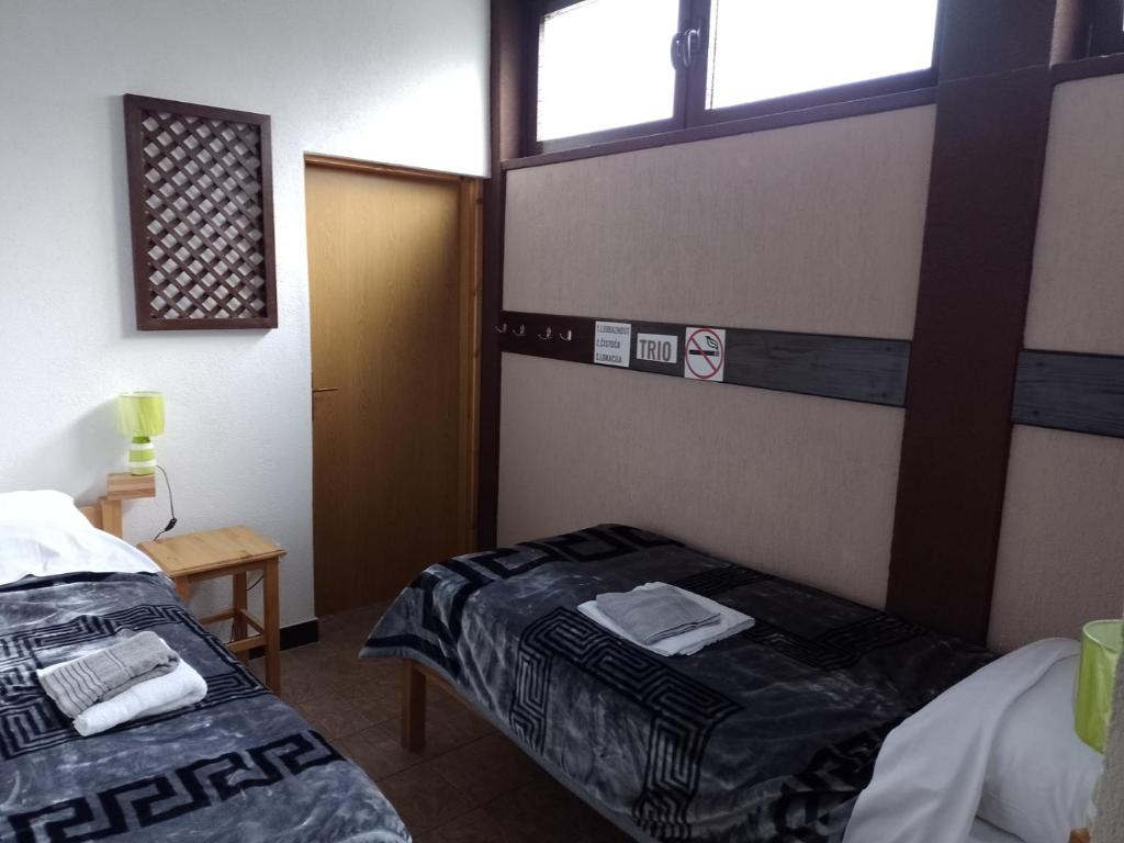Postel nebo postele na pokoji v ubytování TRIO sobe