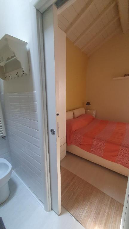 Łóżko lub łóżka w pokoju w obiekcie Sotto Le Stelle Home - una Baita in città