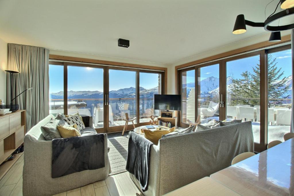 Khu vực ghế ngồi tại ARC 1600, LE RIDGE, Appartement 12 personnes Duplex Vue Montagne - Ski aux pieds - Sauna, Hammam, Piscine intérieure chauffée, Salle de sport & fitness