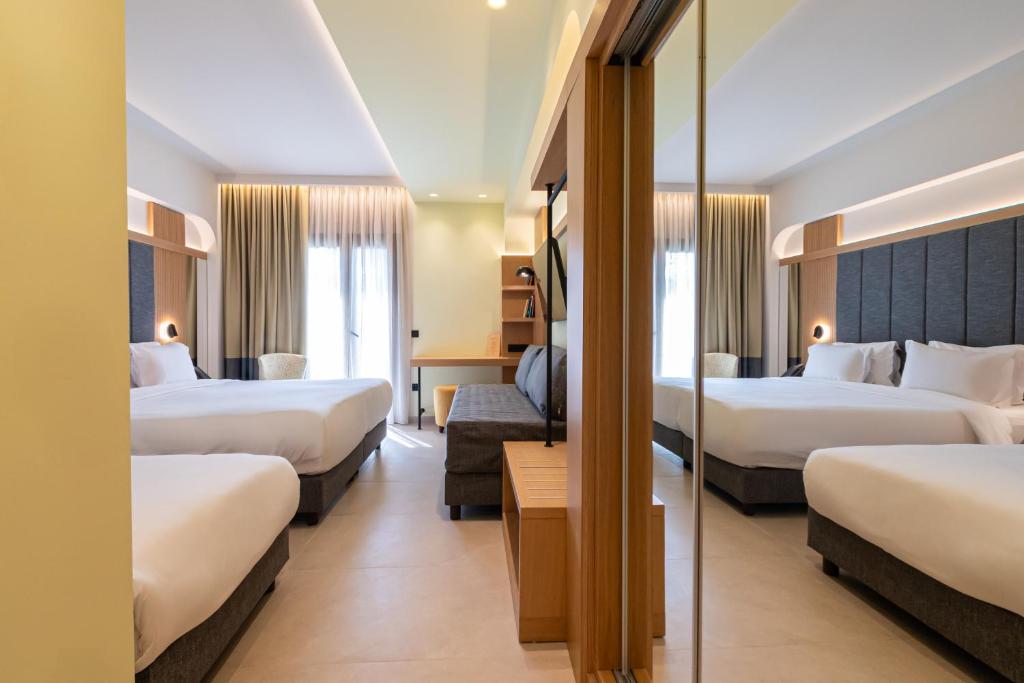 Postel nebo postele na pokoji v ubytování Sokratis Hotel