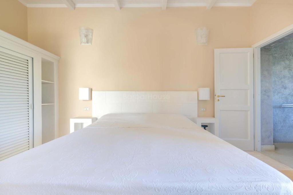 Postel nebo postele na pokoji v ubytování Dimora Cavalieri charming house salento puglia