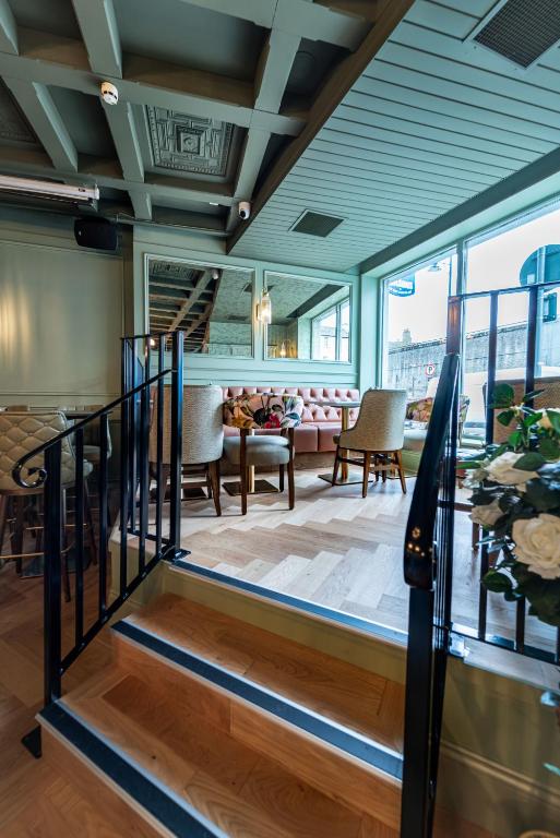 a lobby with a staircase and a living room at The Newgrange Hotel in Navan