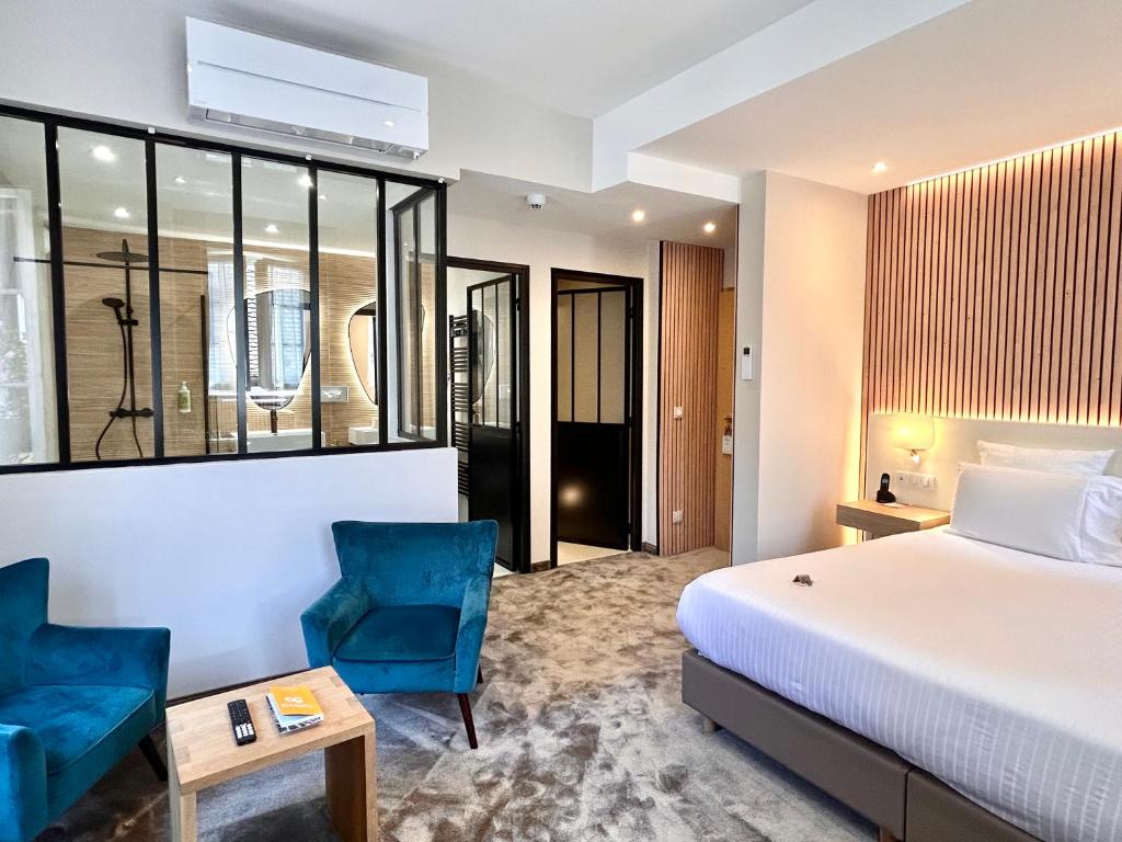 Postel nebo postele na pokoji v ubytování Hotel Beaucour