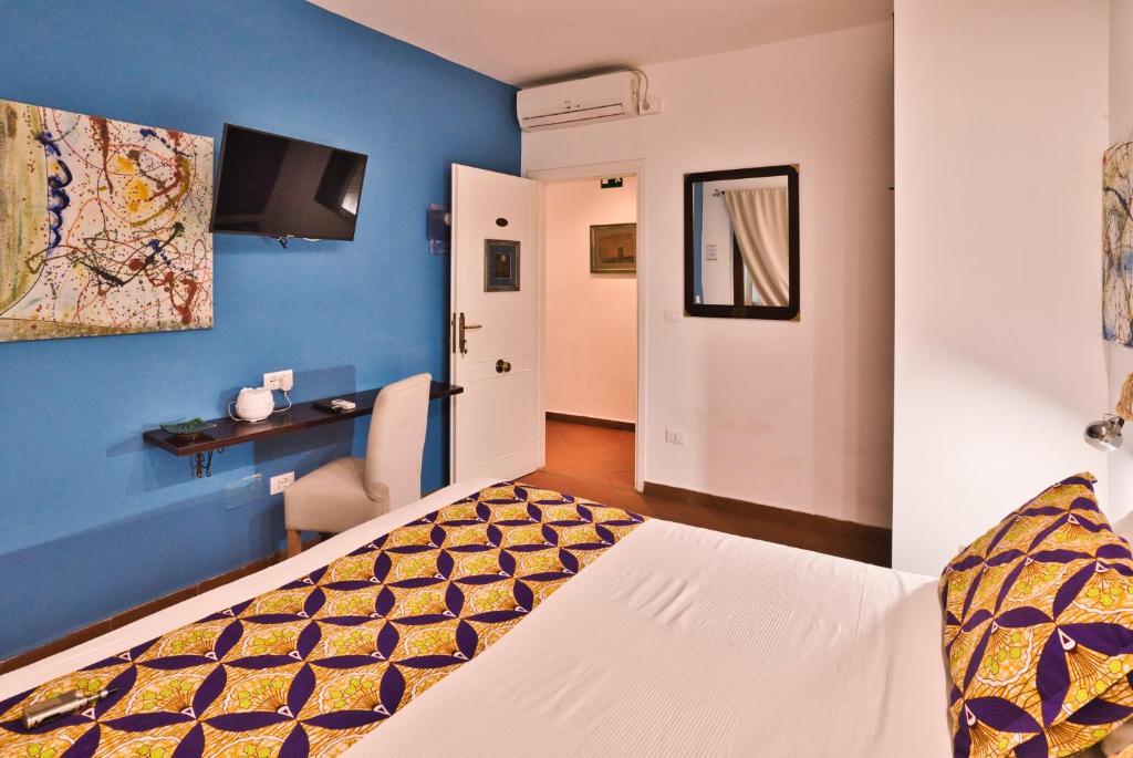 Postel nebo postele na pokoji v ubytování Il Saracino boutique suites