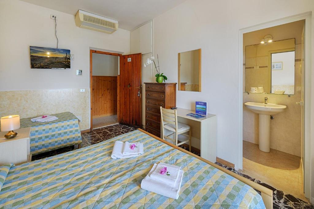 Postel nebo postele na pokoji v ubytování Hotel Edera
