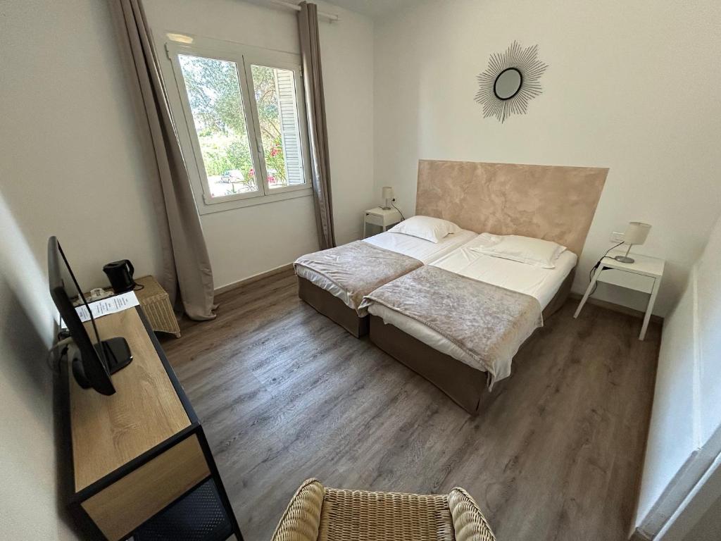Postel nebo postele na pokoji v ubytování L'Aiglon Bylitis