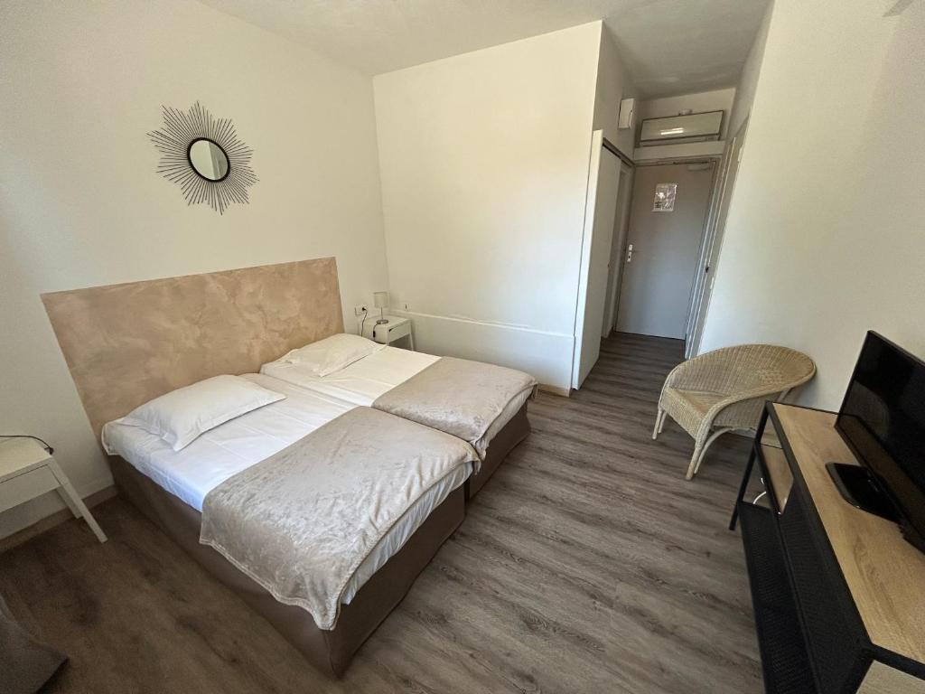 Postel nebo postele na pokoji v ubytování L'Aiglon Bylitis