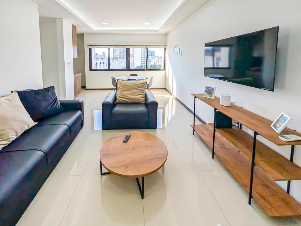 a living room with a couch and a table at Alto Busch1d 4 in El Pary