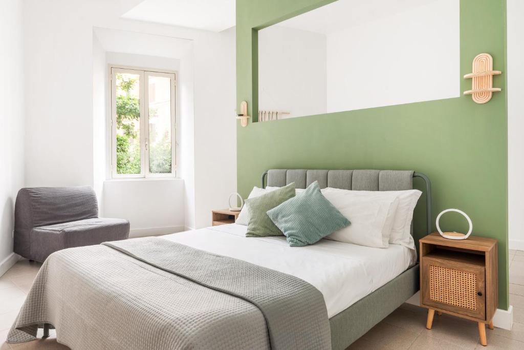 Postel nebo postele na pokoji v ubytování Glory House Trastevere 2