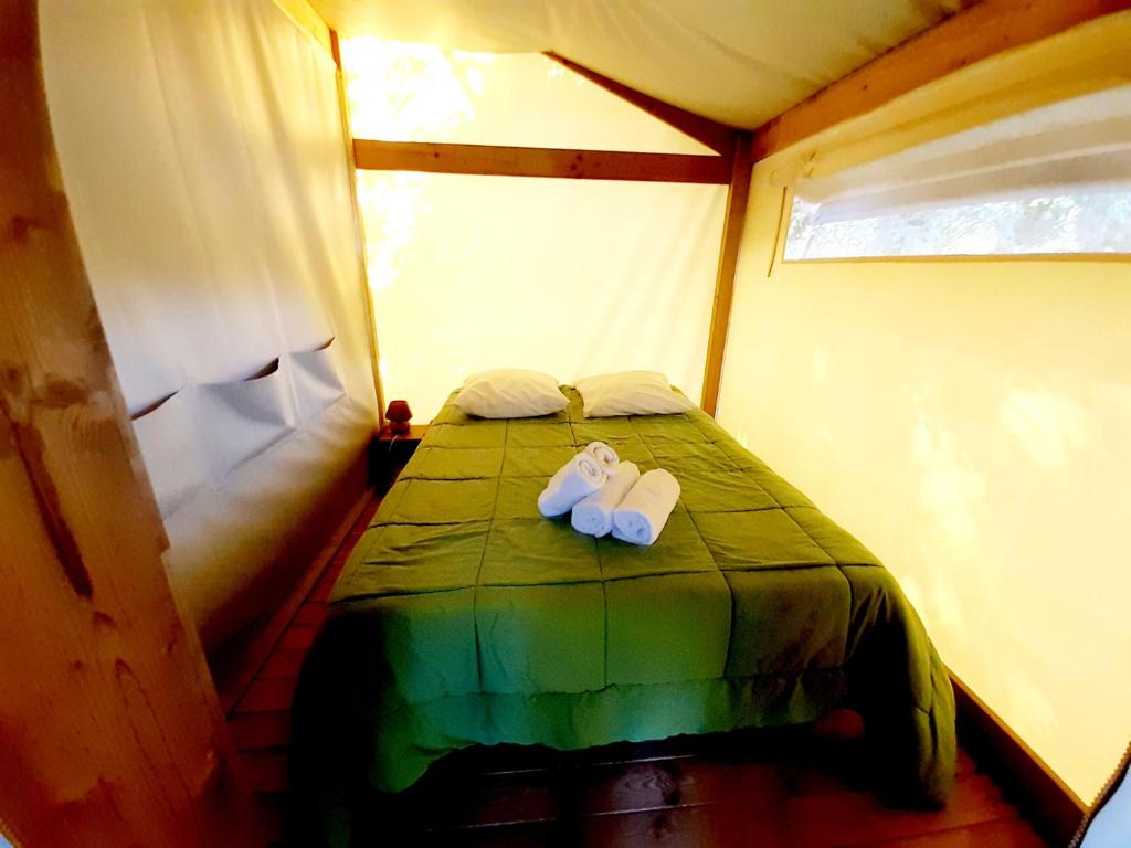 Postel nebo postele na pokoji v ubytování Camping la Venise Verte